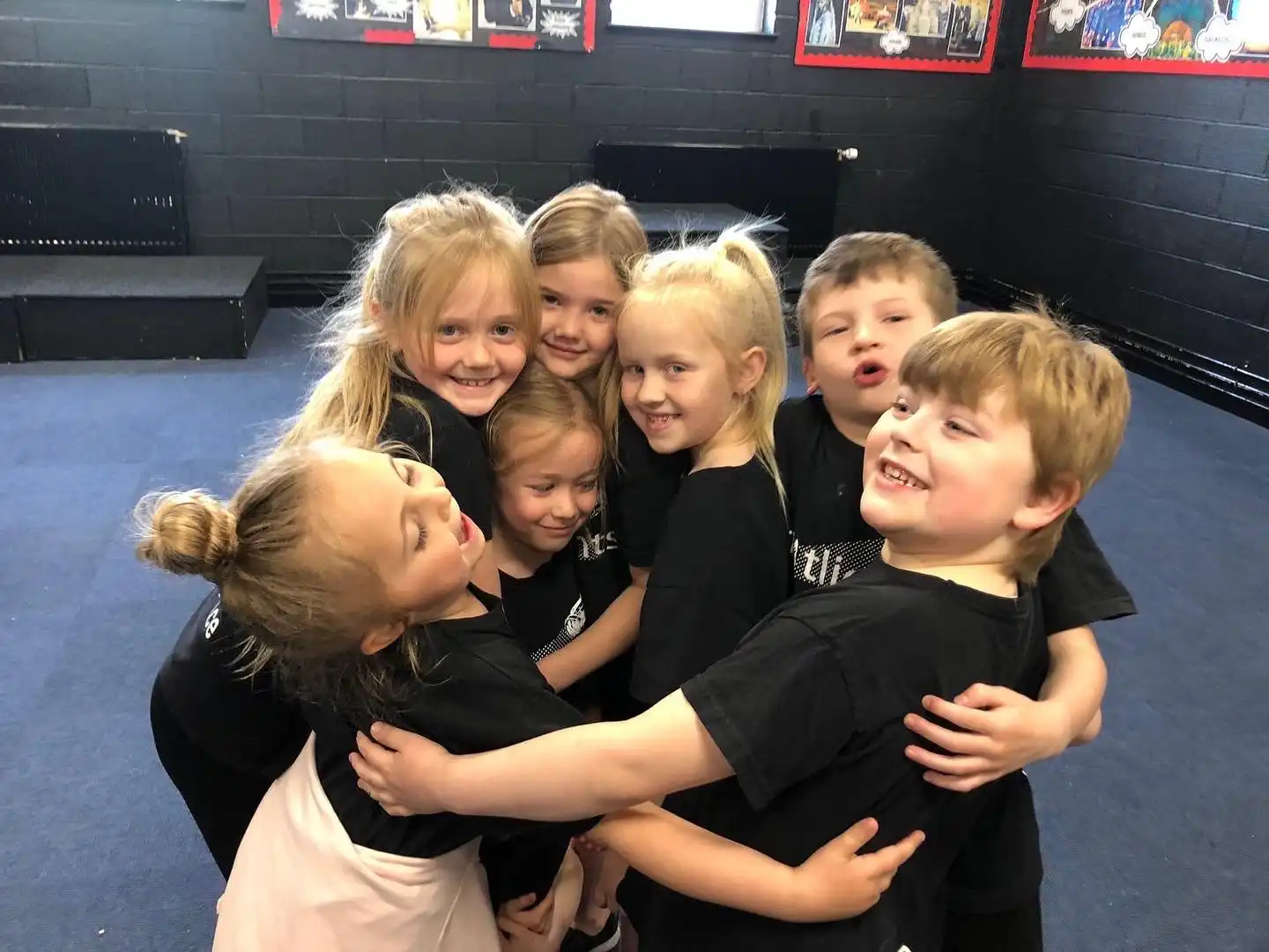 toddlers in a group hug
