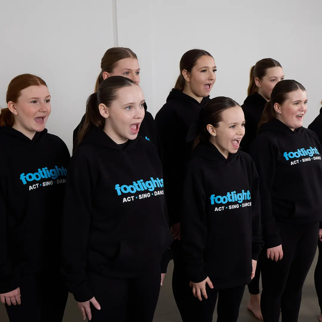 Footlights students taking part in a group singing class